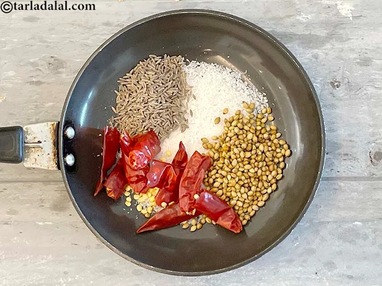 Step 10 – Add&nbsp;<meta charset="UTF-8" />5&nbsp;<a href="glossary-dry-red-chillies-2373i">dry red chillies (pandi)</a>&nbsp;, broken into pieces.