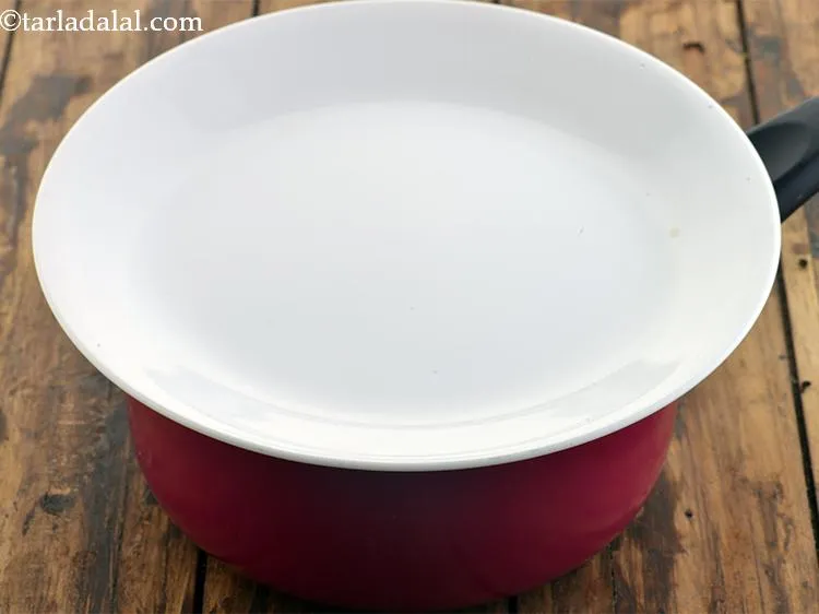 Step 7 – Cover with a lid. The lid will seal the saucepan and will not let the …