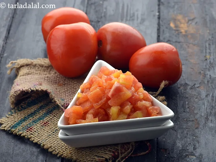 Step 58 – Add 1 1/4 cups&nbsp;<a href="https://www.tarladalal.com/glossary-blanched-and-chopped-tomatoes-1883i">blanched and chopped tomatoes</a>.