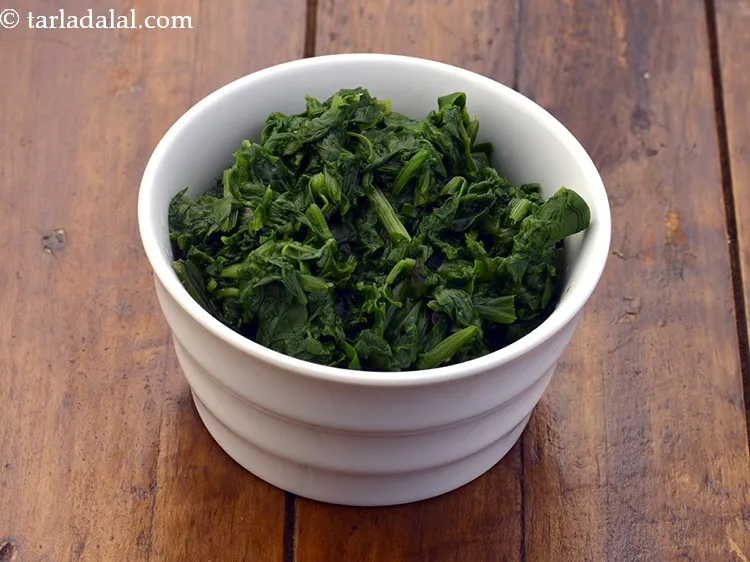 Step 33 – To make <strong>spinach stuffing</strong>, add 2 1/2 cups&nbsp;<a href="https://www.tarladalal.com/glossary-blanched-and-chopped-spinach-1915i">blanched and chopped spinach</a>&nbsp;(palak) in a deep …