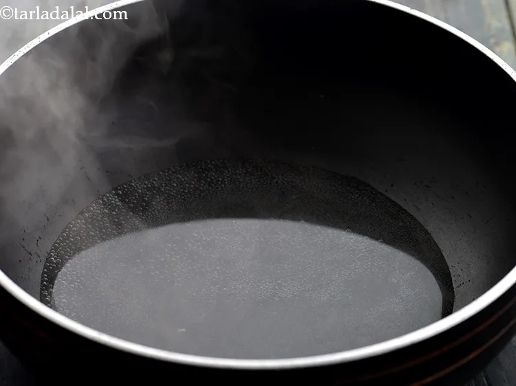 Step 3 – Take a deep non stick pan, add &frac12; cup of water in it and bring …