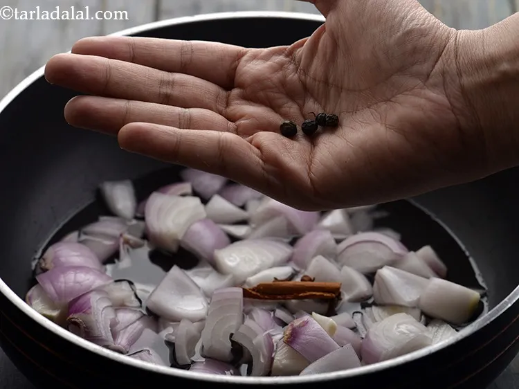 Step 7 – Add the black peppercorns. Whole spices provide a nice flavour to the<strong>Boiled onion paste.</strong>
