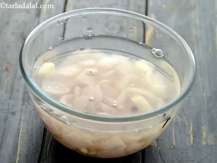 Step 9 – Pour cold water and allow onions to cool slightly.