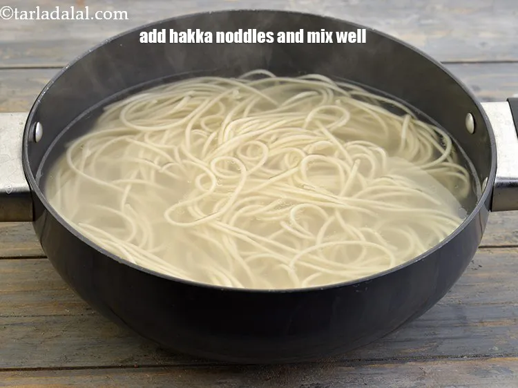 Step 8 – Add the <a href="https://www.tarladalal.com/glossary-boiled-hakka-noodles-2309i">hakka noodles</a>&nbsp;and mix well. We have taken 1&frac12; packet of hakka noodles. …