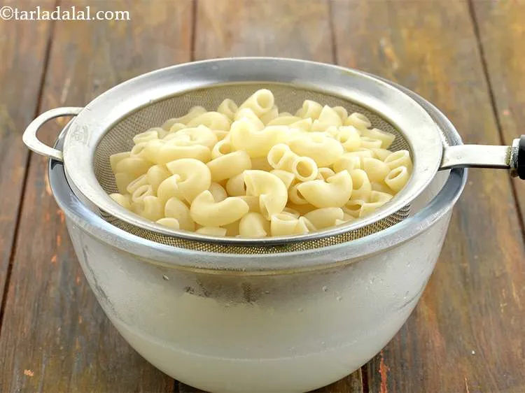 Step 42 – Add 1 cup&nbsp;<a href="https://www.tarladalal.com/glossary-cooked-macaroni-1894i">cooked macaroni</a>.