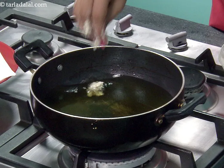 Step 17 – <p>Shape a portion into a round and carefully drop in the hot oil. You can …