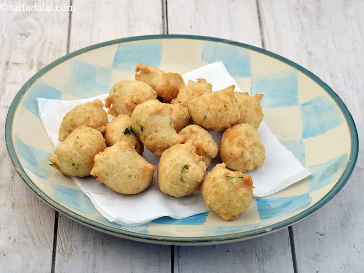 Step 21 – <p>Drain Ulundu Bonda on absorbent paper to remove excess oil.</p>