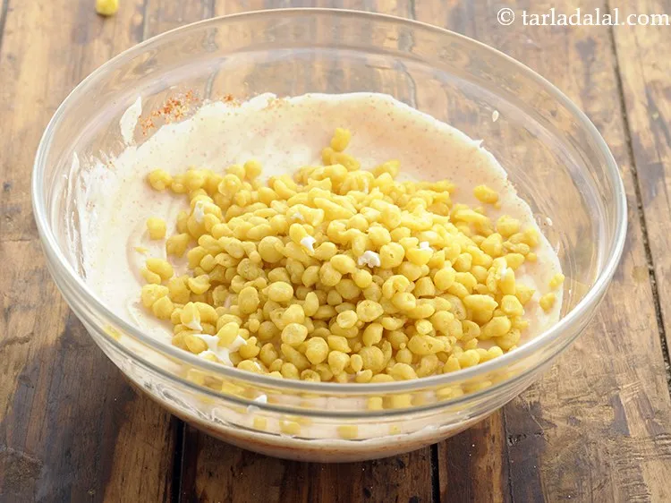 Step 6 – Further, add boondi to the flavored curd. Here we have not soaked the boondi before …