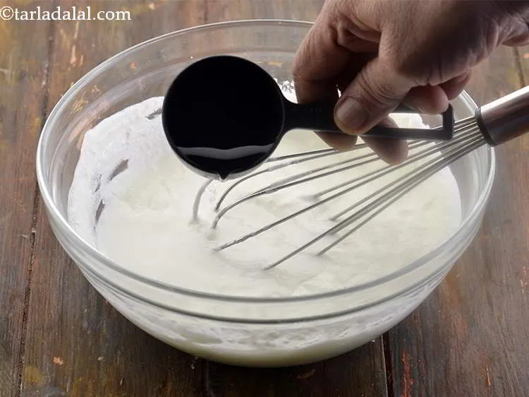 स्टेप 24 – दही को पतला करने के लिए लगभग १/४ कप पानी …
