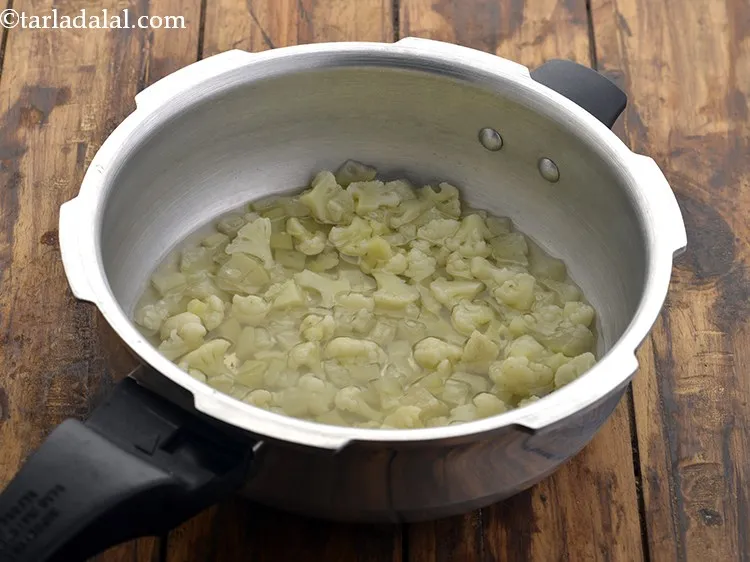 Step 26 – Open the lid of the pressure cooker. This is how cooked mixture for <strong>Bottle Gourd …