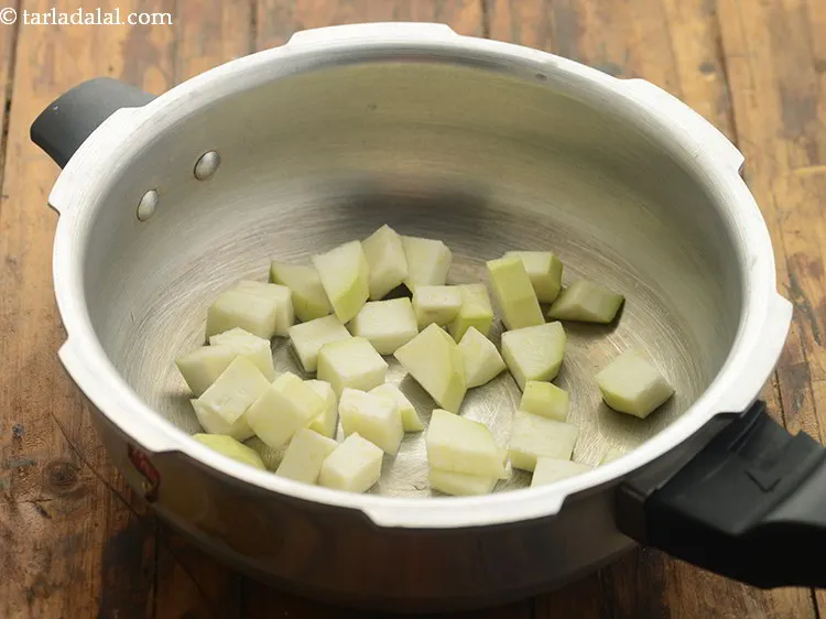 Step 13 – Transfer the chopped doodhi pieces of <strong>bottle gourd soup for babies and kids</strong> into a …
