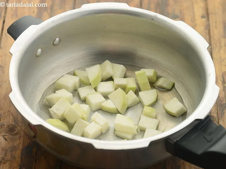 Step 14 – Add &frac34; cup of water to it for cooking.