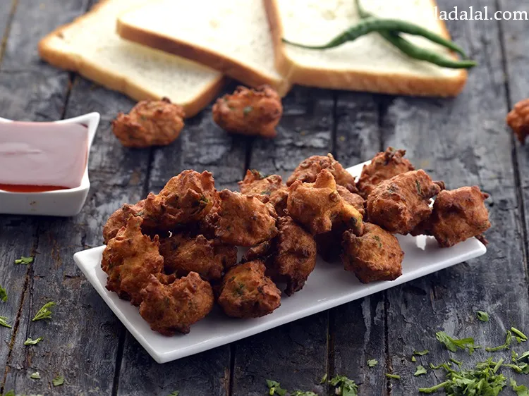 Step 17 – Serve the <strong>bread bhajia</strong> immediately with <a href="https://www.tarladalal.com/Tomato-Ketchup-Tomato-Sauce-Homemade-Tomato-Ketchup-40725r" target="_blank">tomato ketchup</a>. <strong>Bread Bhajiyas</strong> is a perfect …