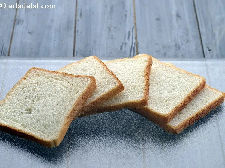 Step 2 – For preparing the batter for <strong>bread bhajiya</strong>, place bread slices on a clean &amp; dry …