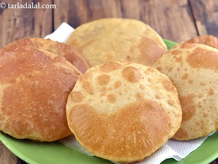 Step 16 – Heat the oil in a deep non-stick deep pan and deep-fry the bhatura, one at …
