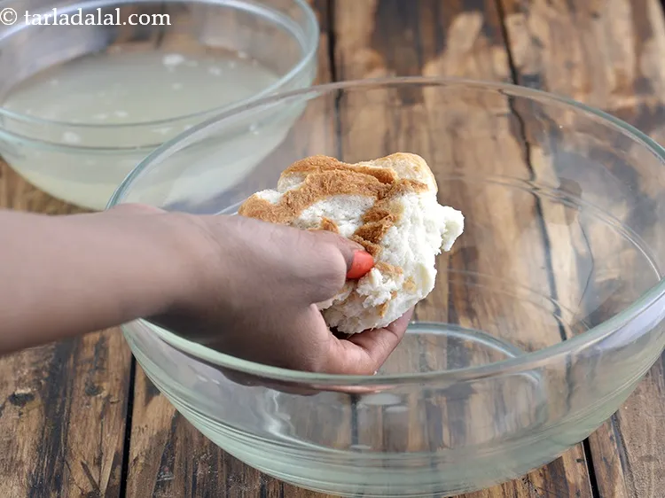 Step 6 – Squeeze out all the excess water from the bread slices by pressing it between your …