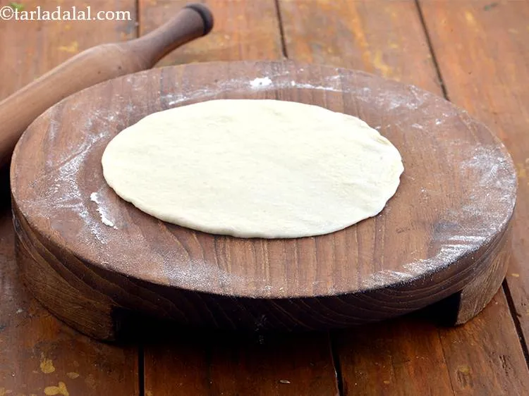 Step 15 – Roll each portion of the dough into a 125 mm. (5&quot;) diameter circle without using …