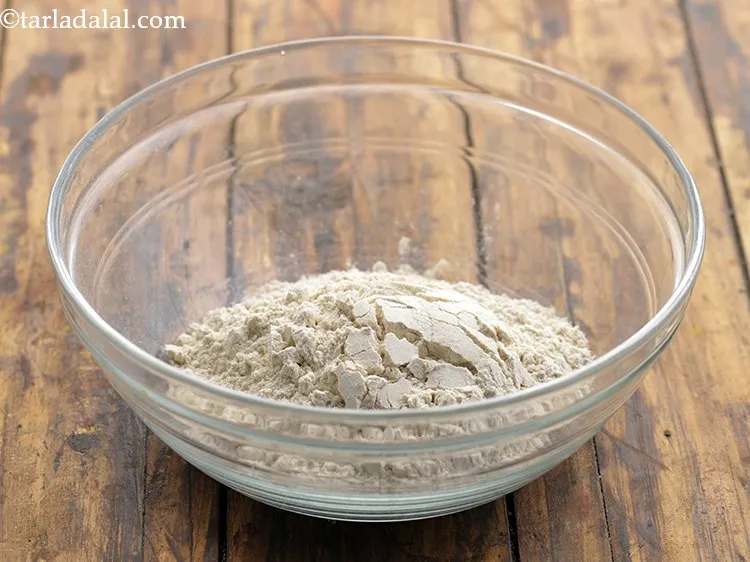 Step 8 – Add 1/2 cup&nbsp;<a href="https://www.tarladalal.com/glossary-whole-wheat-flour-gehun-ka-atta-gehun-ka-aata-429i">whole wheat flour (gehun ka atta)</a>.