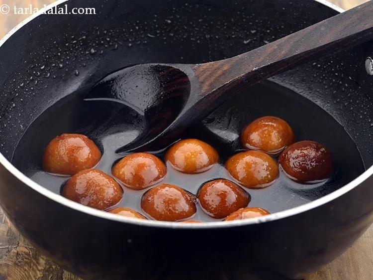 Step 30 – Keep it aside for atleast 2 hours at room temperature. The bread gulab jamuns will …