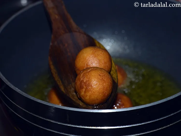 Step 27 – Continue deep frying for some more time. This is stage 2 -golden brown in colour …