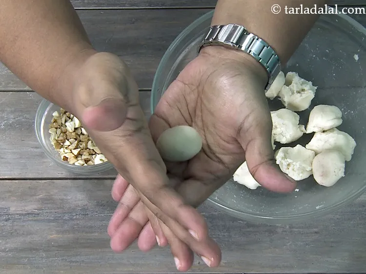 Step 16 – Take a portion of the dough and roll in between your palms to smoothen it …