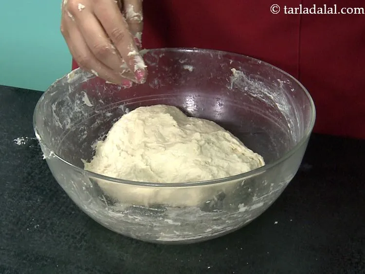 Step 13 – Knead again very well till the dough is smooth and elastic. You have to knead …