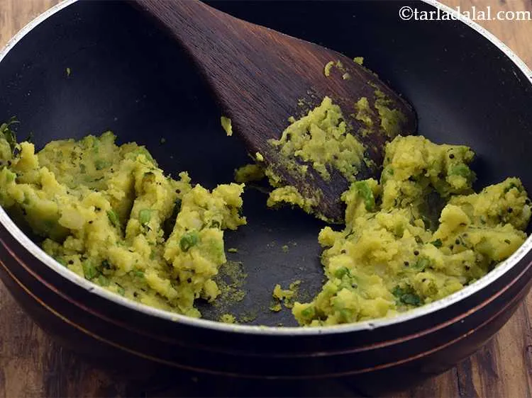 Step 12 – Divide the aloo masala into 2 equal portions. Keep aside.