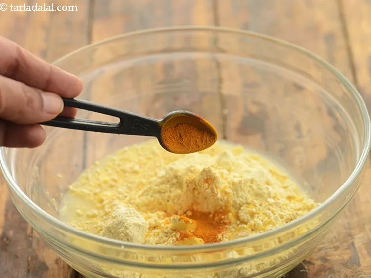 Step 12 – Add some turmeric powder to give a yellow hue to the batter.