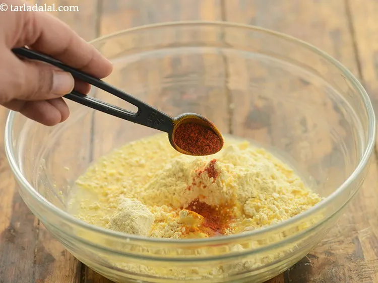 Step 13 – For a spicy hint, add little chilli powder.