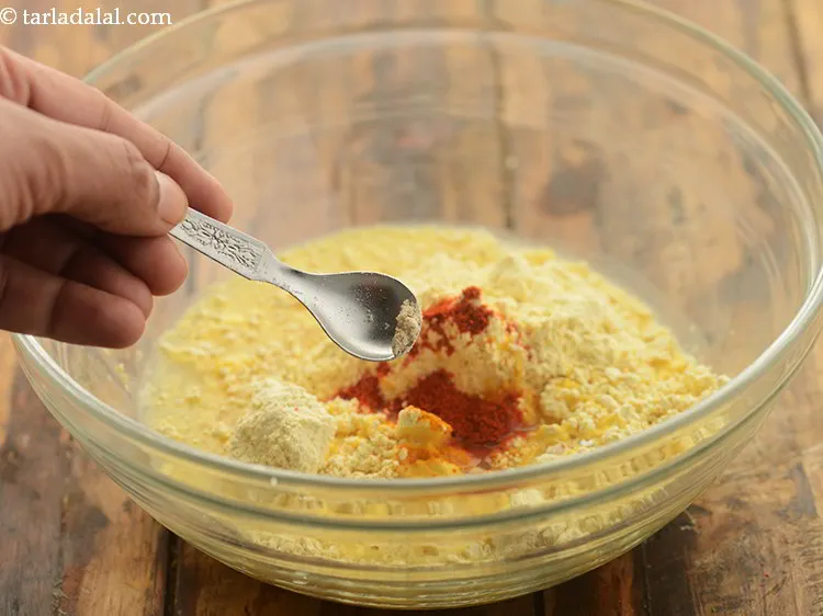 Step 14 – Furthermore, add a pinch of asafoetida. It helps aid digestion.