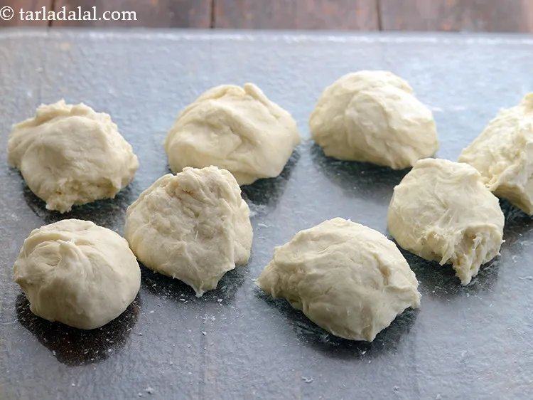 Step 15 – Lightly punch down the dough and divide the <strong>French bread roll</strong> dough into 8 equal …