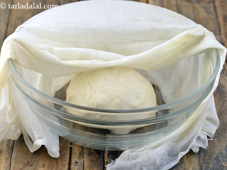 Step 13 – Cover the dough with a damp muslin cloth and keep aside in a warm place …
