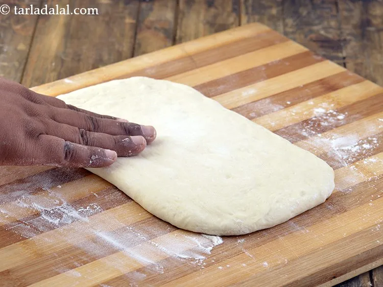 Step 15 – Put the dough over it and pat it lightly with your fingers to shape into …