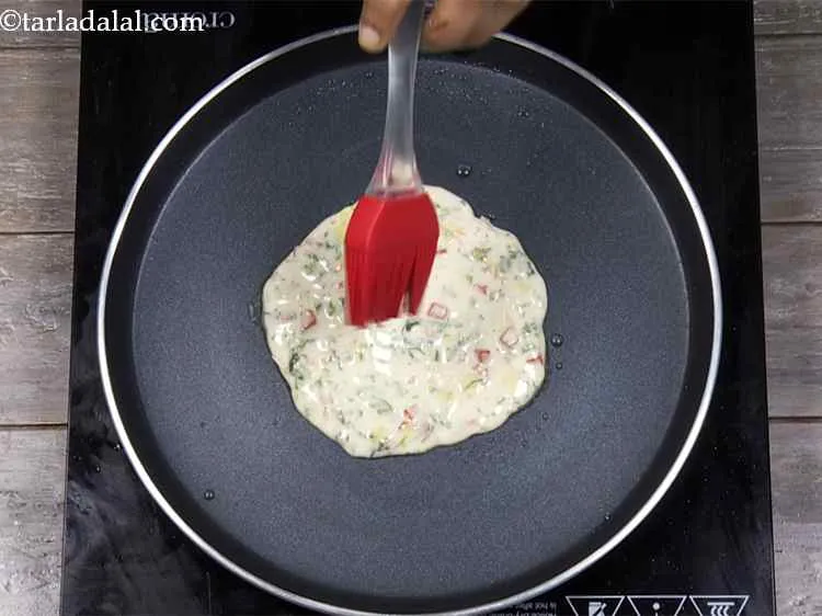 Step 17 – <p>Pour 1/2 tsp of oil on the top and edges and cook on a medium …