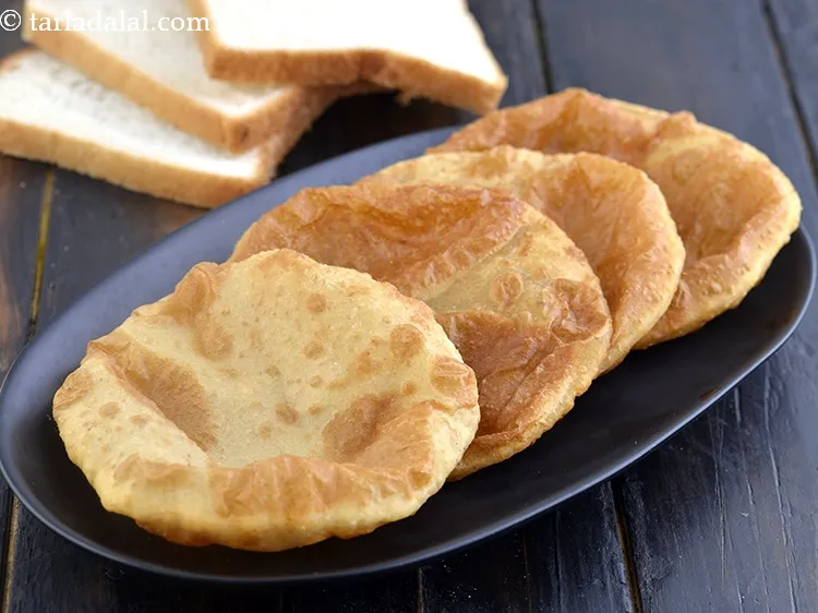 Step 21 – Serve these bhatura immediately, else they might turn chewy.&nbsp;