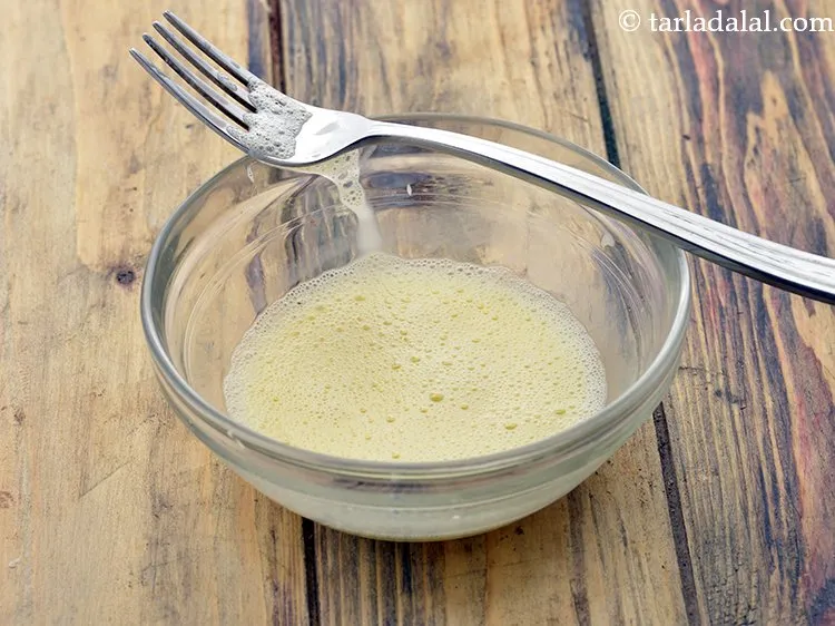 Step 45 – Combine the egg yolk and milk in a small bowl and mix well.<br /> &nbsp;