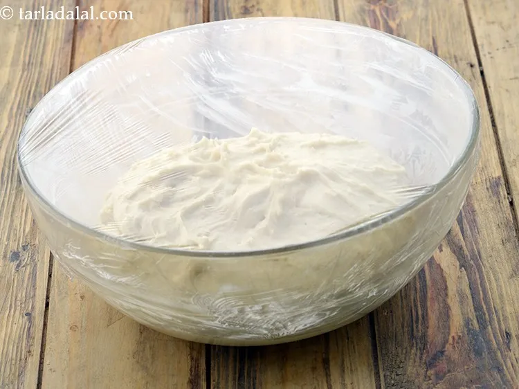Step 40 – Transfer the dough in a greased deep bowl, cover it with the cling wrap and …