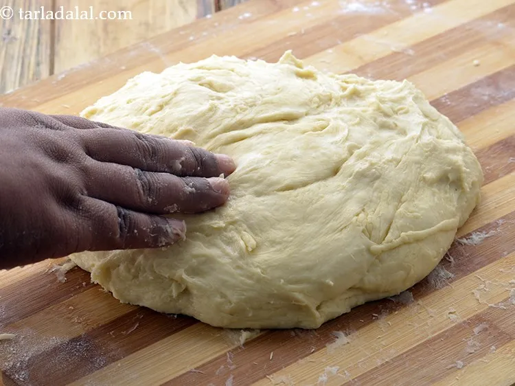 Step 42 – Place the dough over it and knead it again. This kneading is important for the …