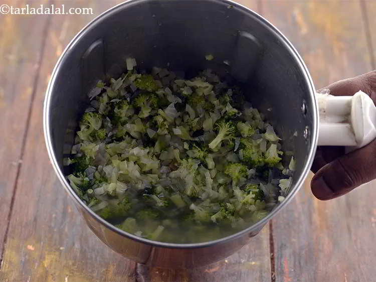 Step 14 – Once the broccoli is slightly cooled, transfer the mixture to a mixer jar.