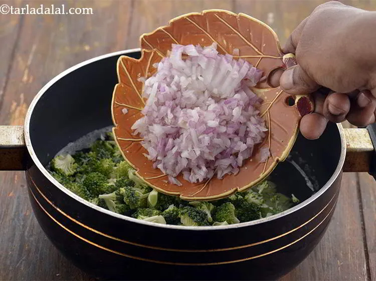 Step 9 – Also, add the onions.