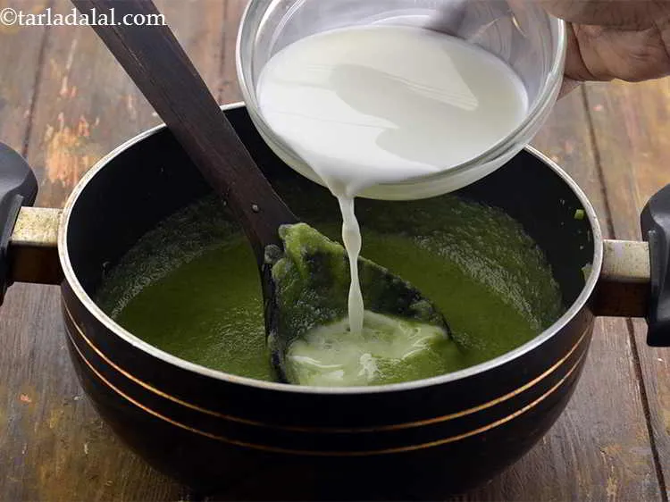 Step 17 – Add the milk, mix well and cook on a medium flame for 2 minutes, while …