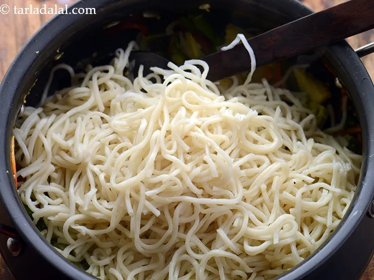 Step 13 – Add boiled hakka noodles.&nbsp;