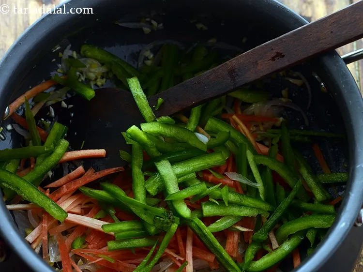 Step 8 – Add capsicum. These veggies will add crunch to our noodles.