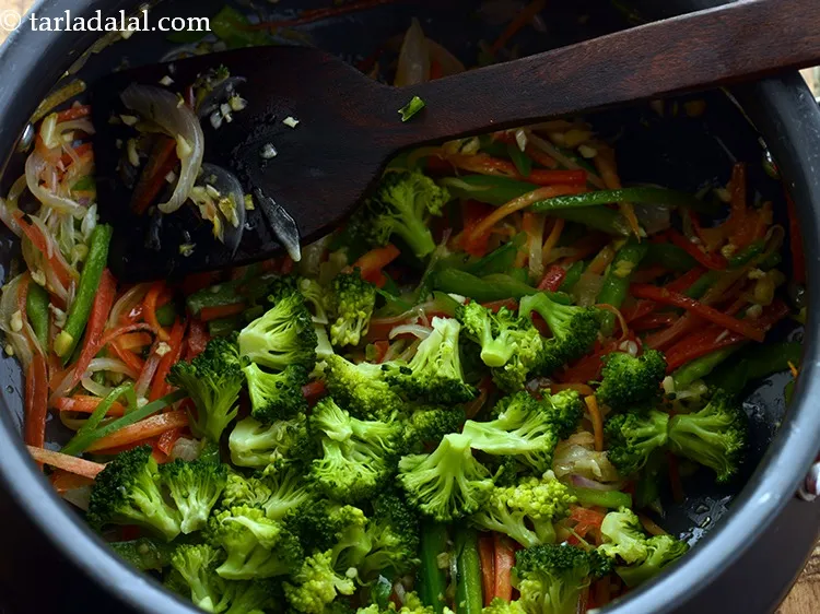 Step 10 – Add broccoli. Here, we are using blanched broccoli.