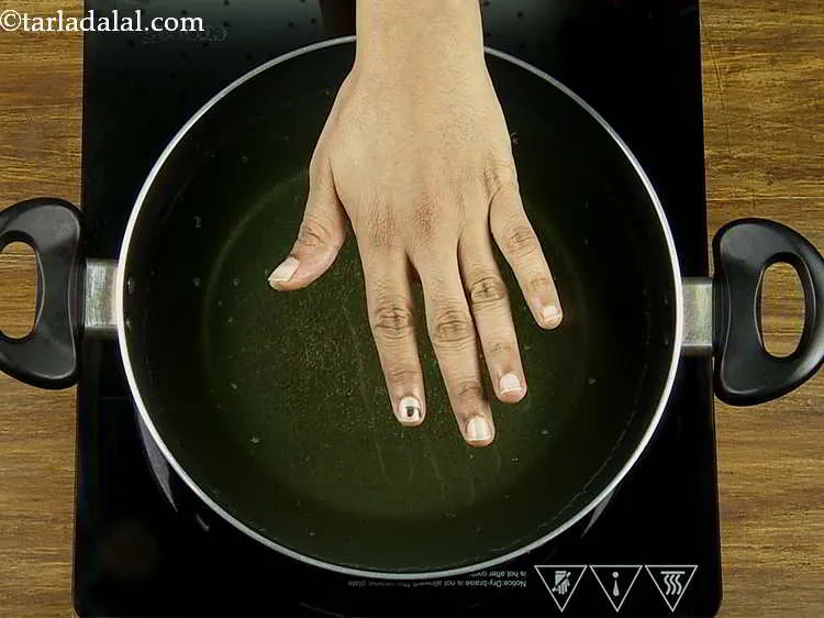 Step 20 – Heat the oil in a deep non-stick pan.