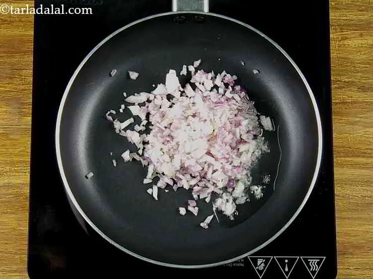 Step 3 – Once the oil is moderately hot, add the onions.