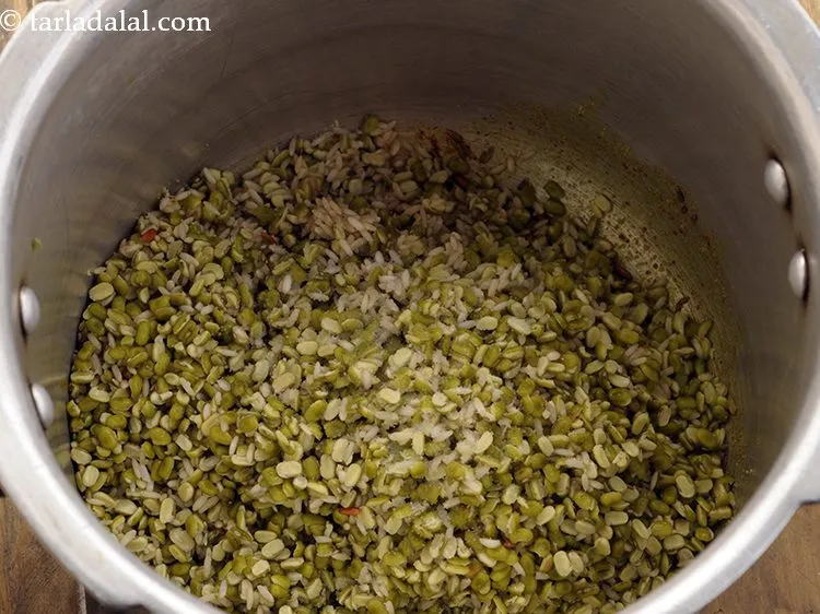 Step 16 – Add rice-moong dal and salt.