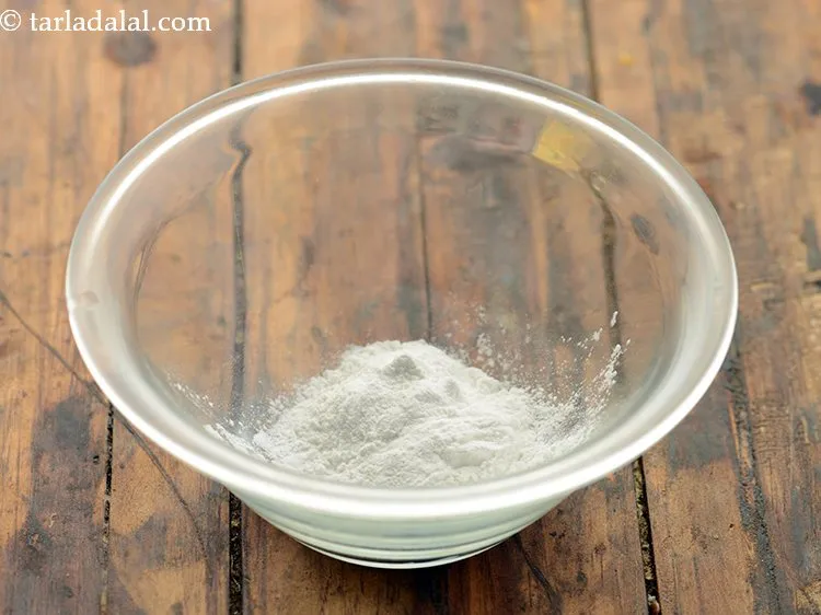 Step 9 – To make <strong>Indian style brown rice vegetable risotto</strong>, start with taking cornflour in a small …