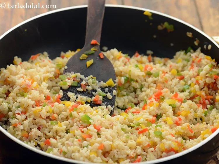 Step 19 – Mix well and cook<strong> garlic brown rice risotto</strong>, &nbsp;on a medium flame for 2 minutes, …