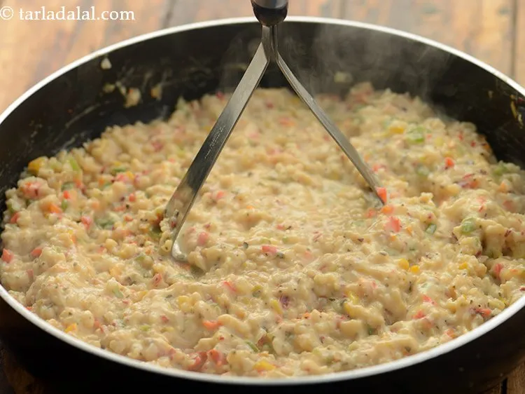 Step 27 – Mash well using a potato masher.